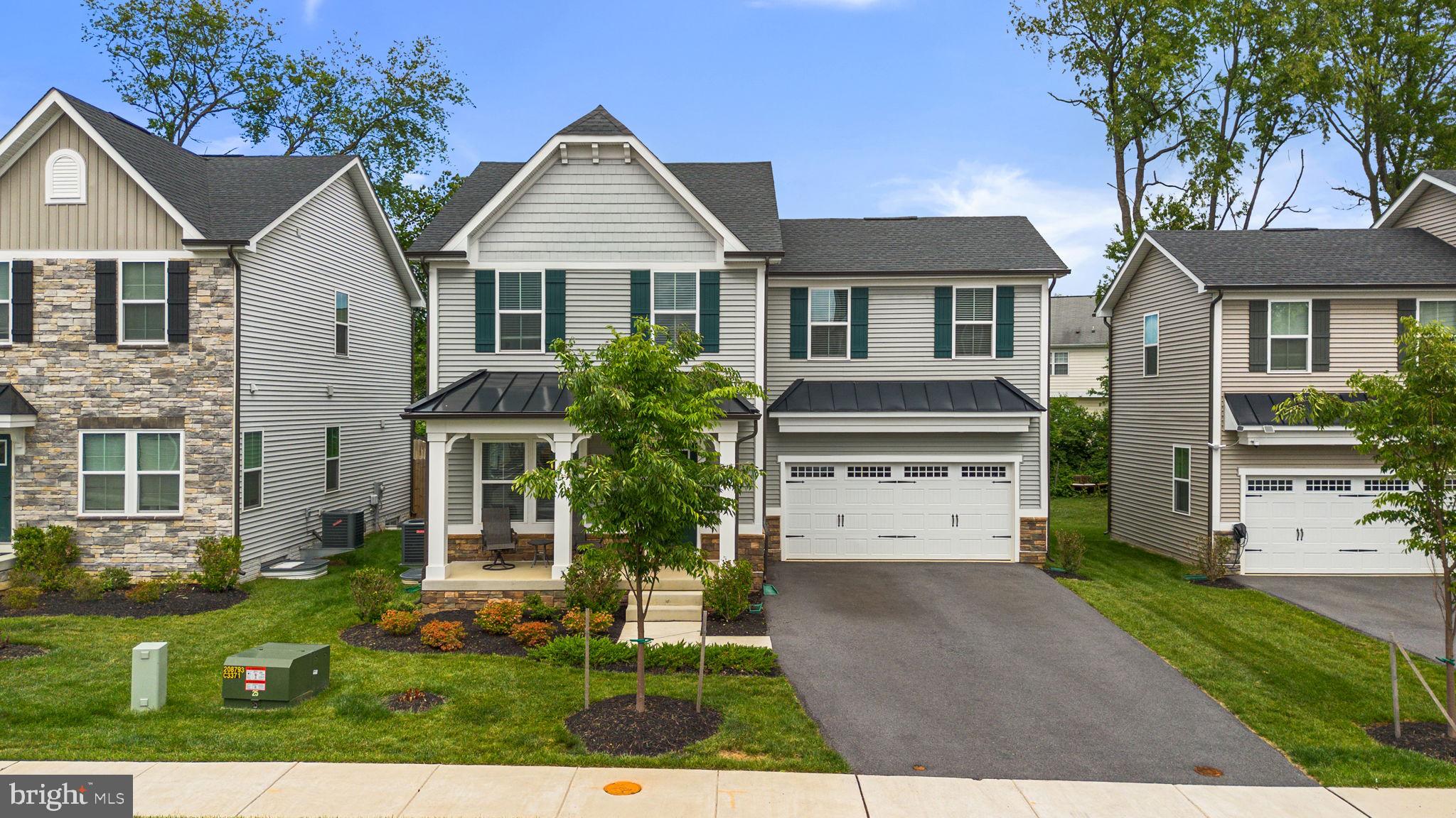 1713 Aurora Way Frederick, MD 21702 - Photo 2 of 57 front view of a house with a yard