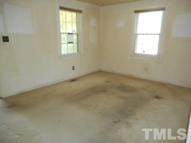 907 Newcombe Road Raleigh, NC 27610 - Photo 4 of 9 an empty room with a window