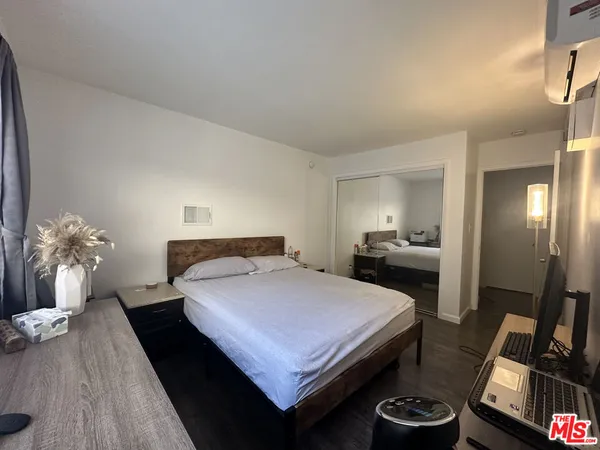 a bedroom with a bed and a table in it