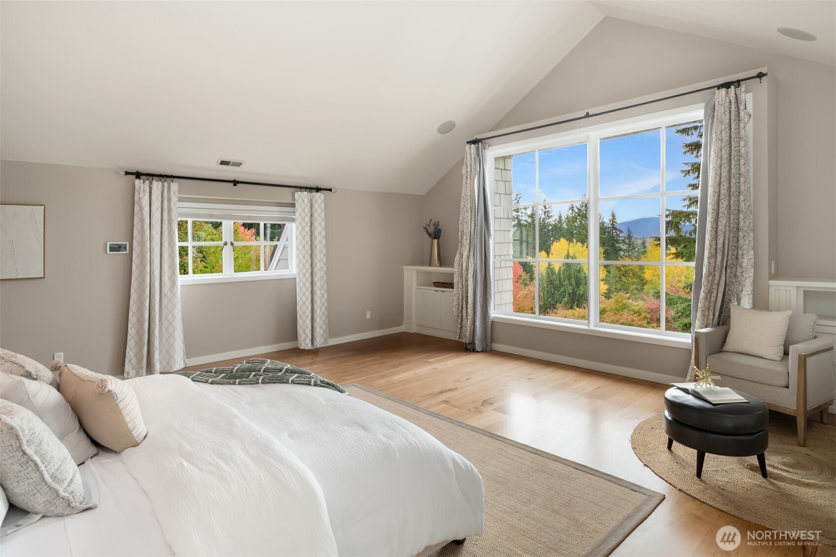 26133 Northeast 34th Street Redmond, WA 98053 - Photo 22 of 40 a bedroom with a bed and a couch