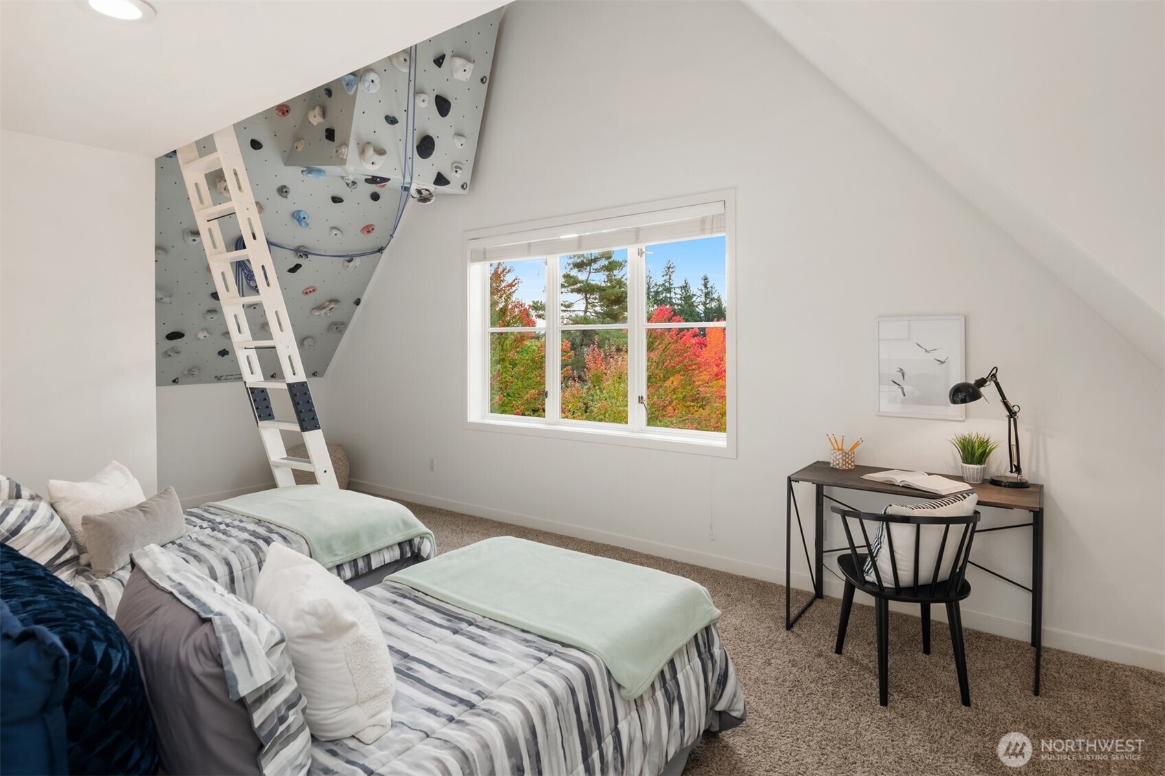 26133 Northeast 34th Street Redmond, WA 98053 - Photo 28 of 40 a bedroom with a bed and a table in it