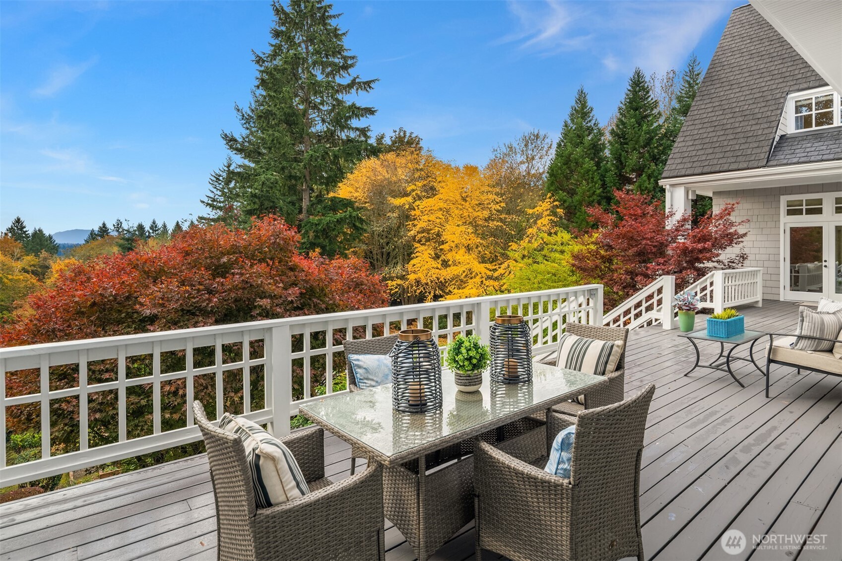 26133 Northeast 34th Street Redmond, WA 98053 - Photo 36 of 40 a view of a chair and table on the wooden deck