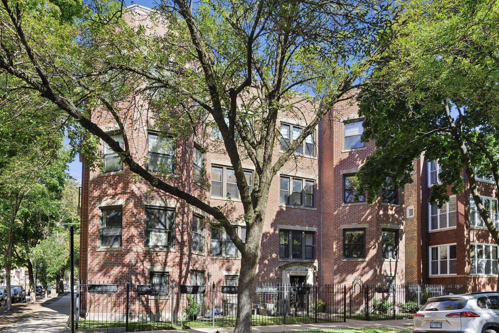 1254 West Eddy Street, Unit 2 Chicago, IL 60657 - Photo 1 of 14 a view of a building with a tree