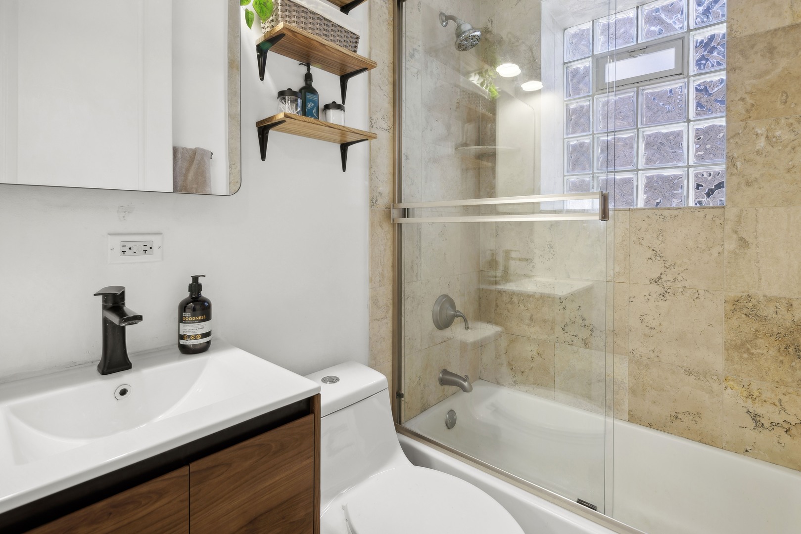 1254 West Eddy Street, Unit 2 Chicago, IL 60657 - Photo 12 of 14 a bathroom with a sink a toilet and shower