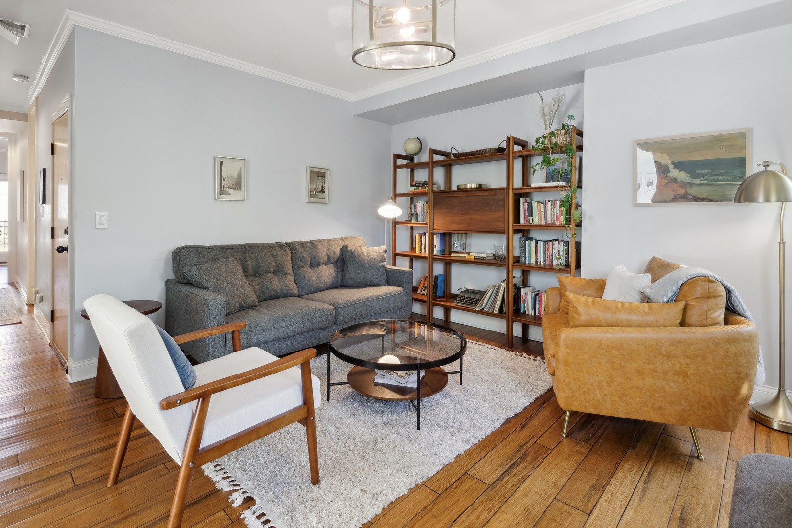 1254 West Eddy Street, Unit 2 Chicago, IL 60657 - Photo 3 of 14 a living room with furniture a rug and a window