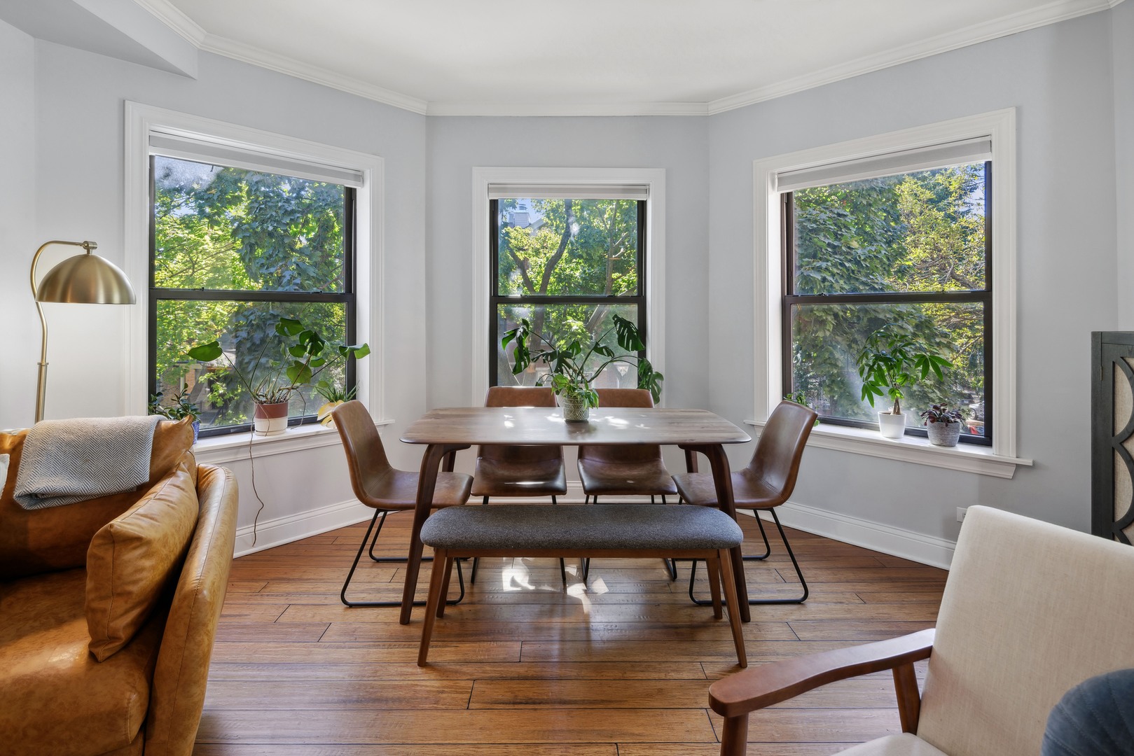 1254 West Eddy Street, Unit 2 Chicago, IL 60657 - Photo 5 of 14 a view of a dining room with furniture window and wooden floor