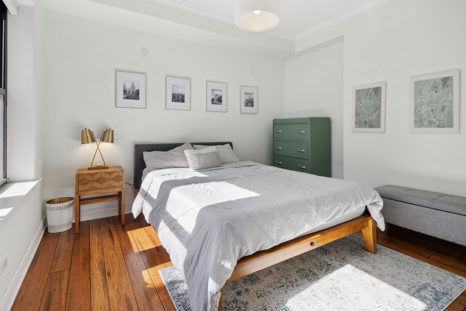 1254 West Eddy Street, Unit 2 Chicago, IL 60657 - Photo 6 of 14 a bedroom with a bed and wooden floor