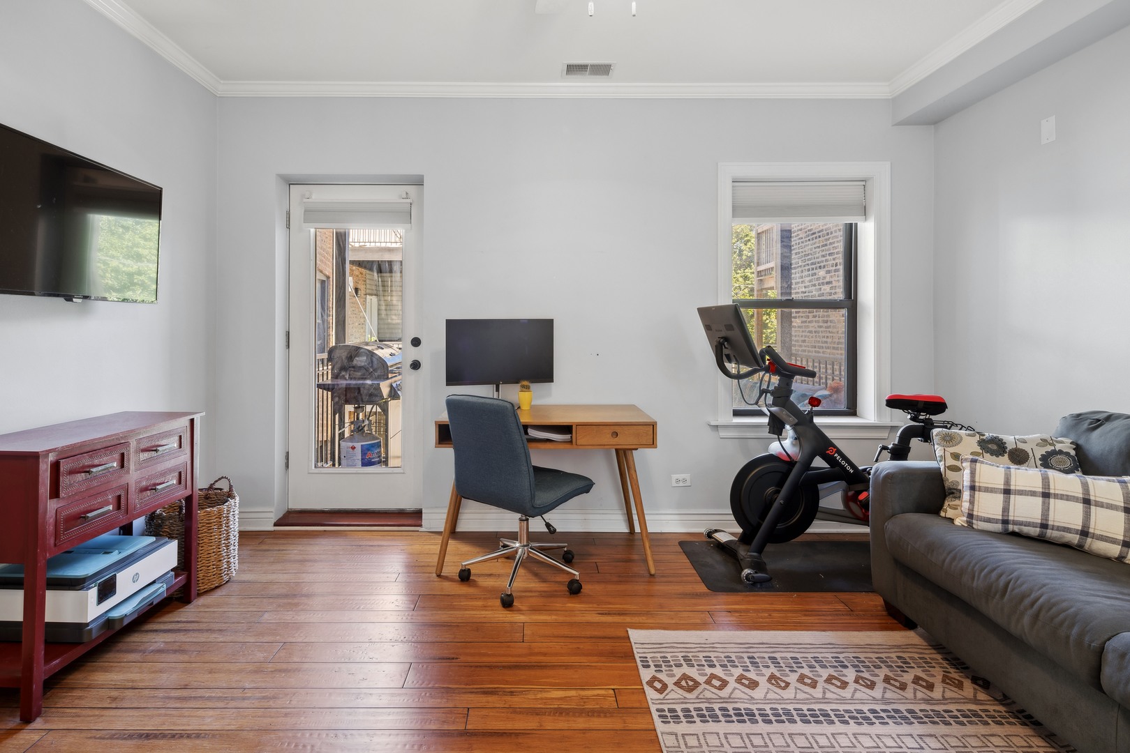 1254 West Eddy Street, Unit 2 Chicago, IL 60657 - Photo 8 of 14 a view of a livingroom with workspace and a couch