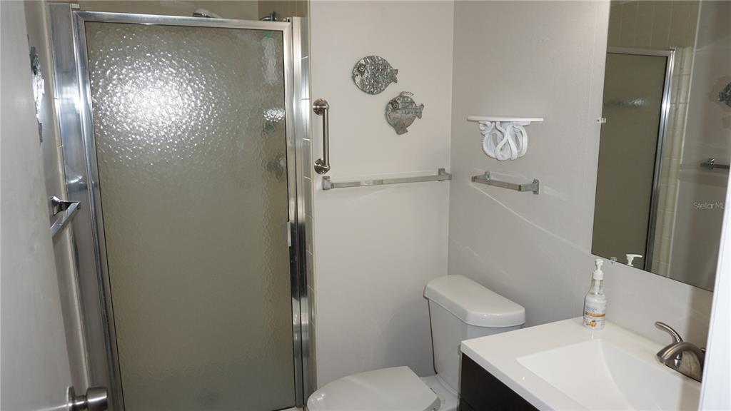 13012 Wedgewood Way, Unit A Hudson, FL 34667 - Photo 20 of 31 a bathroom with a sink and toilet