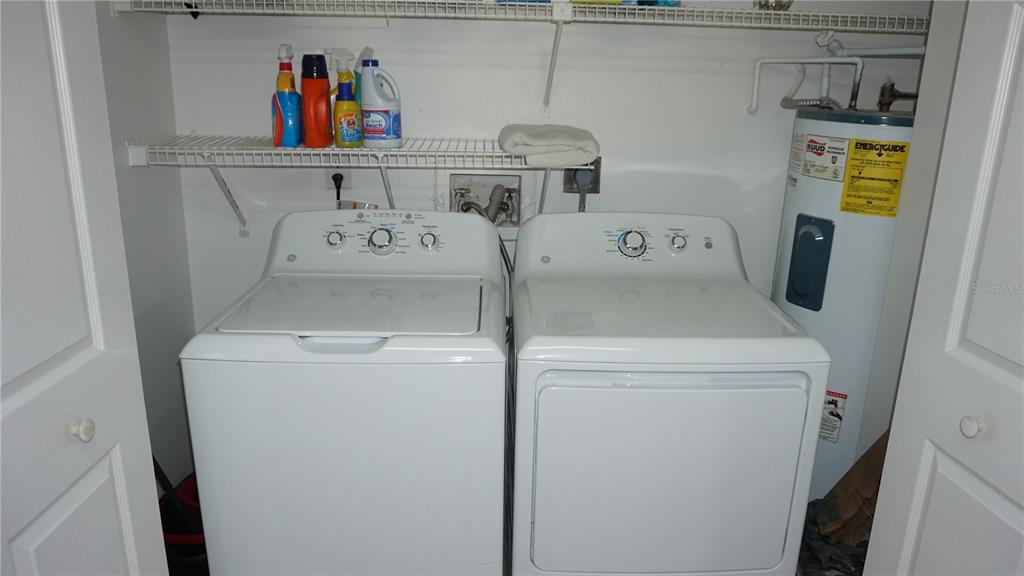 13012 Wedgewood Way, Unit A Hudson, FL 34667 - Photo 10 of 31 a utility room with dryer and washer