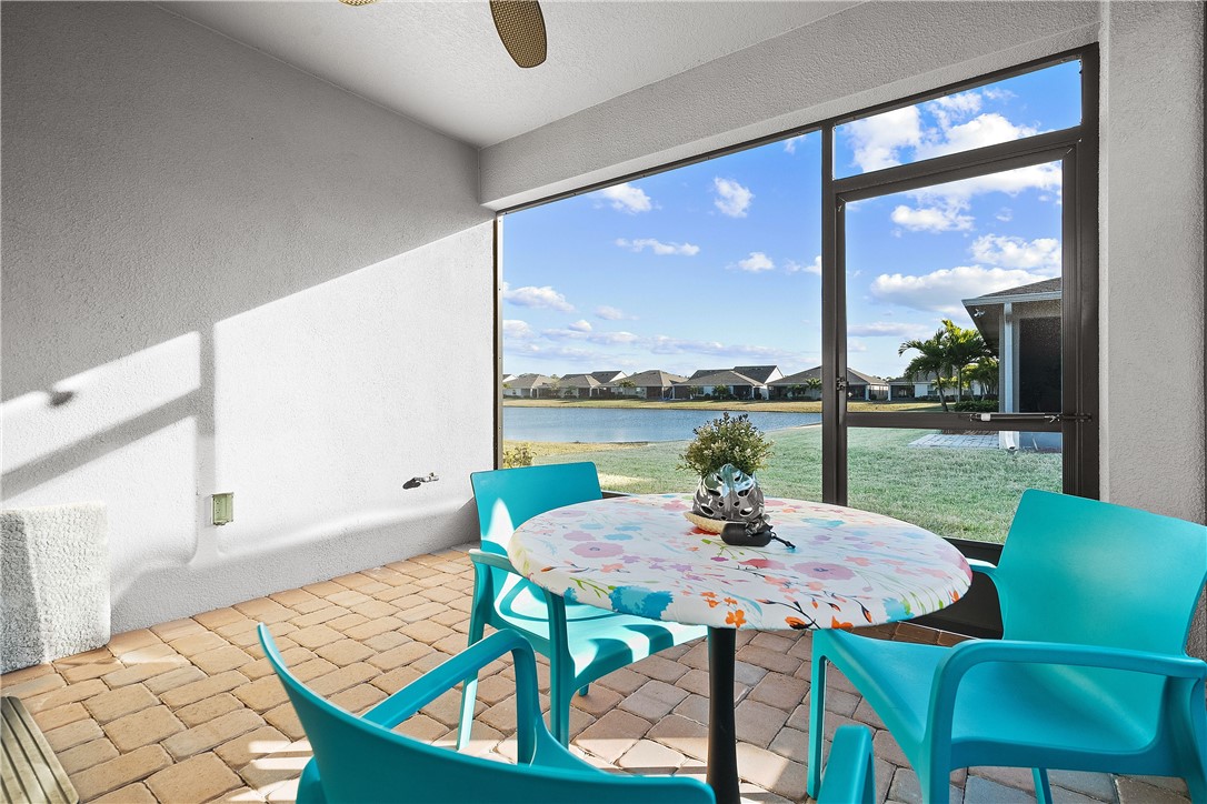 6187 Red Maple Manor Vero Beach, FL 32966 - Photo 23 of 31 a view of a dining room with furniture window and outside view