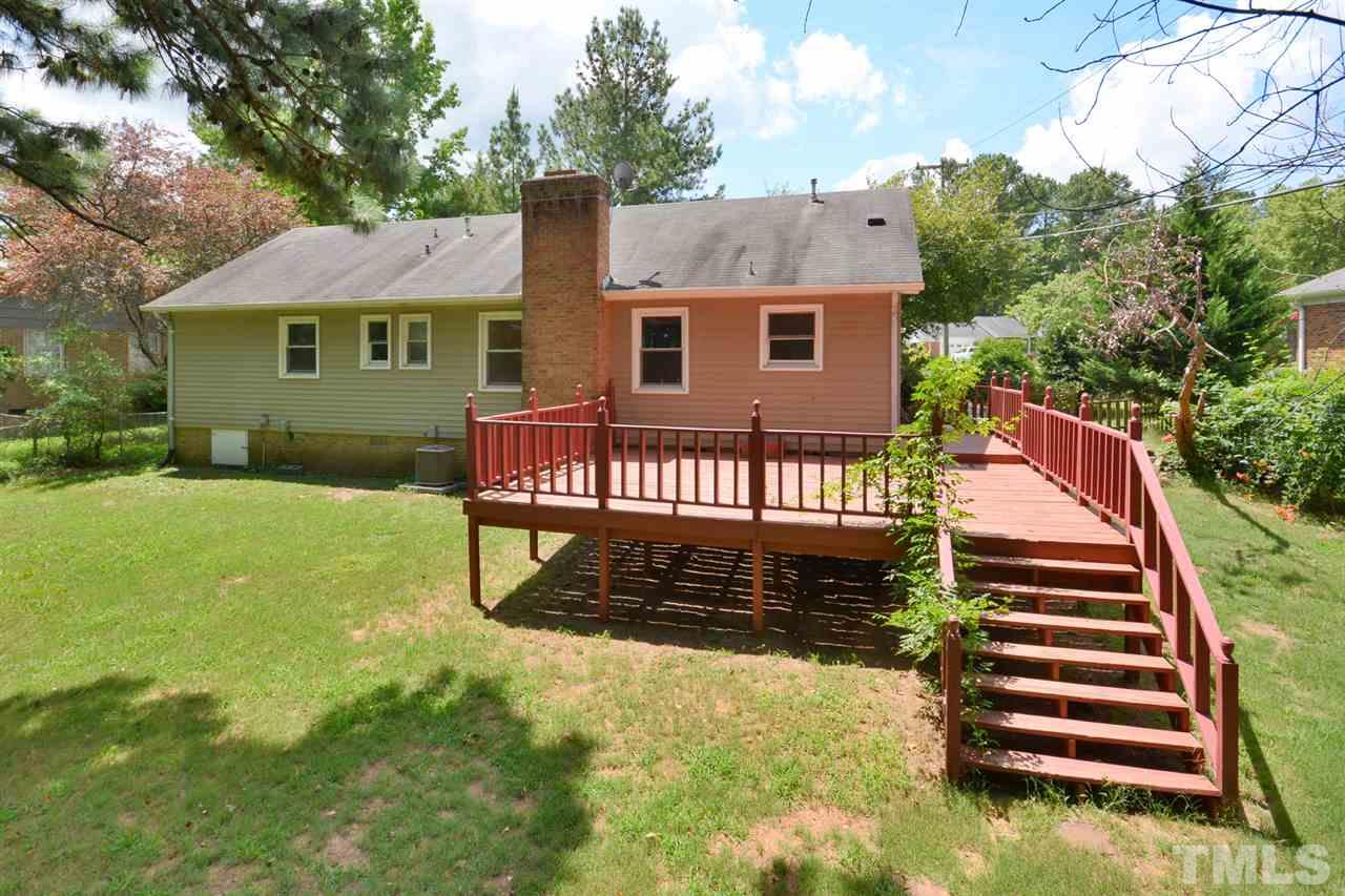 5525 McCormick Road Durham, NC 27713 - Photo 22 of 25 a view of a house with a yard