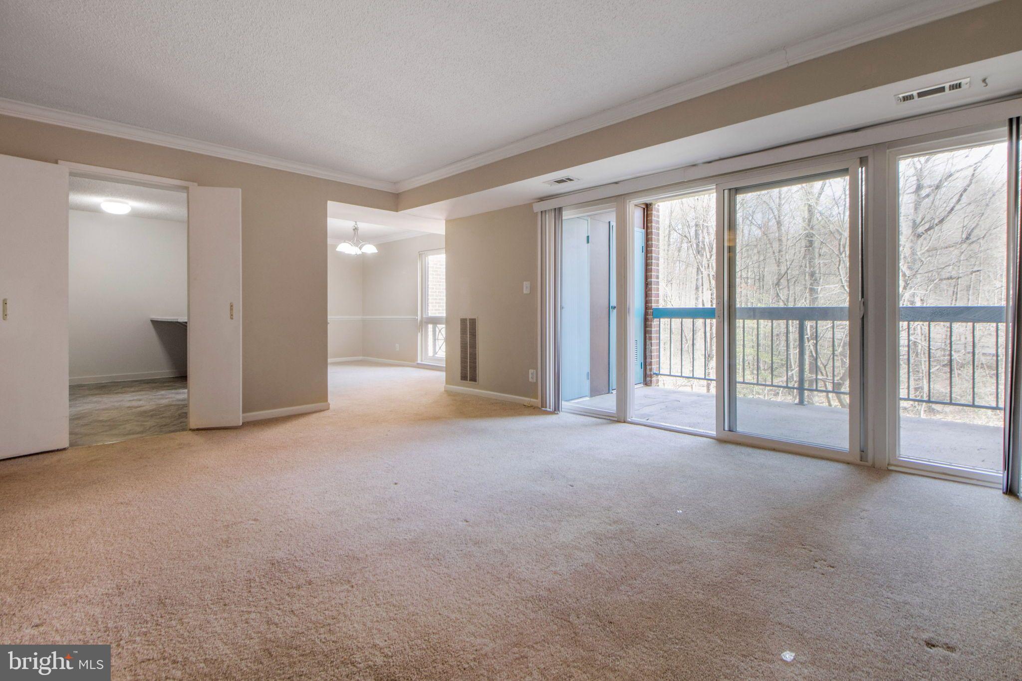 11841 Shire Court, Unit 21B Reston, VA 20191 - Photo 10 of 35 Entire Wall of Glass in Living Room