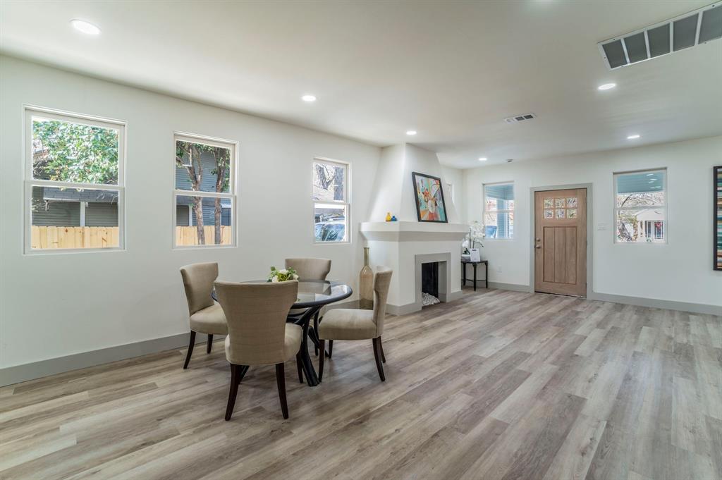 5914 Victor Street Dallas, TX 75214 - Photo 11 of 32 a view of a dining room with furniture window and wooden floor