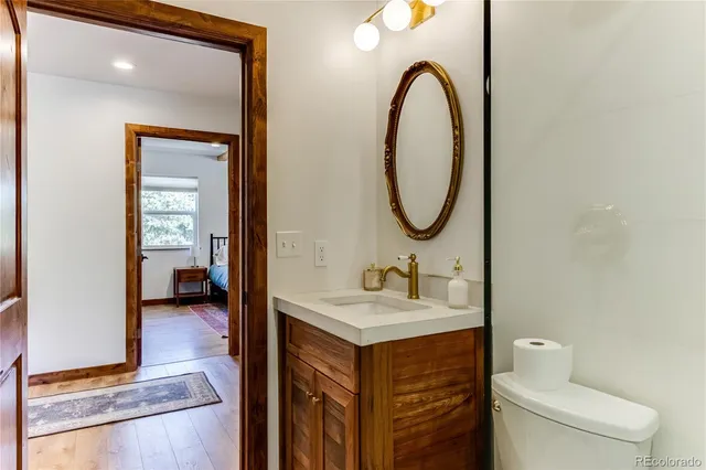 a living room with furniture and stairs