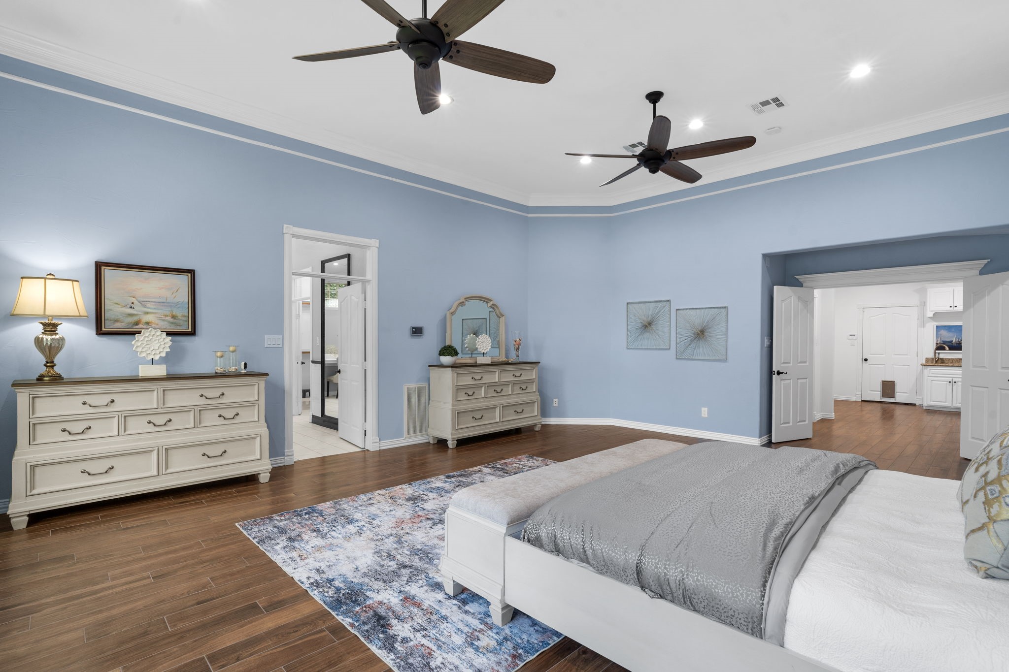 20002 Indigo Lake Drive Magnolia, TX 77355 - Photo 14 of 50 a bedroom with a large bed and a dresser