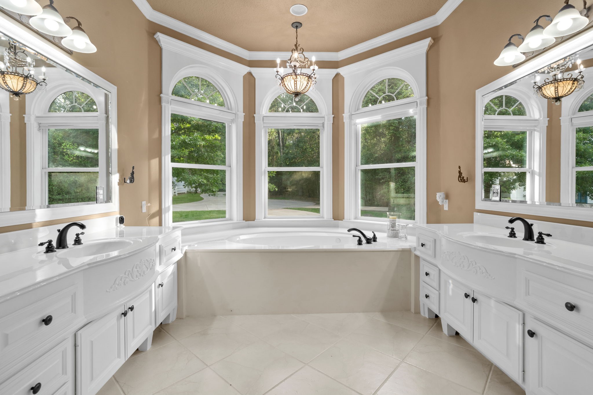 20002 Indigo Lake Drive Magnolia, TX 77355 - Photo 21 of 50 a large white bathroom with a large tub sink and mirror