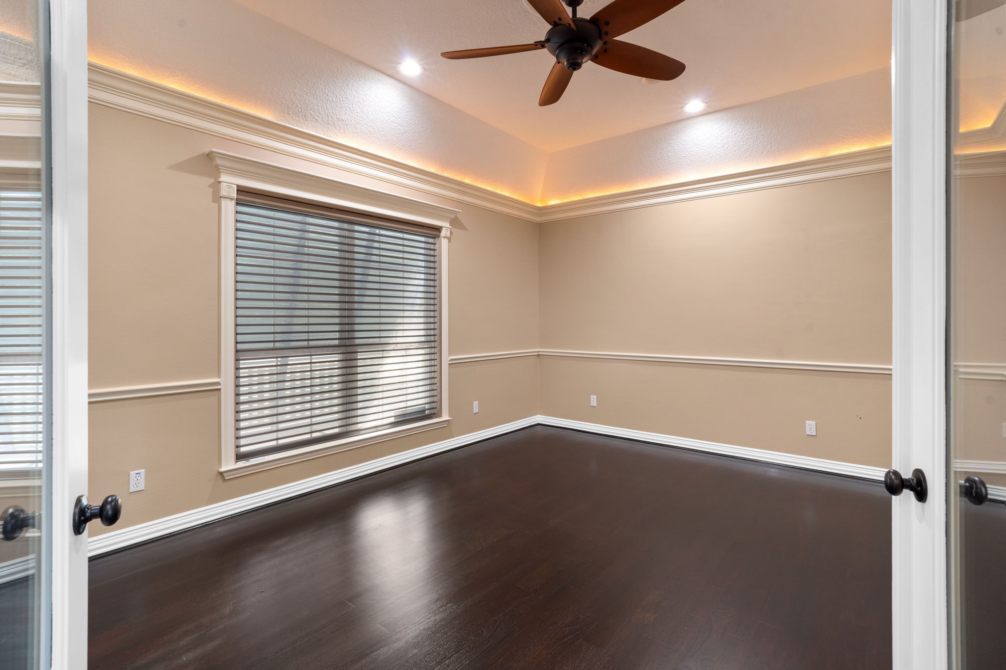 20002 Indigo Lake Drive Magnolia, TX 77355 - Photo 22 of 50 an empty room with wooden floor fan and windows