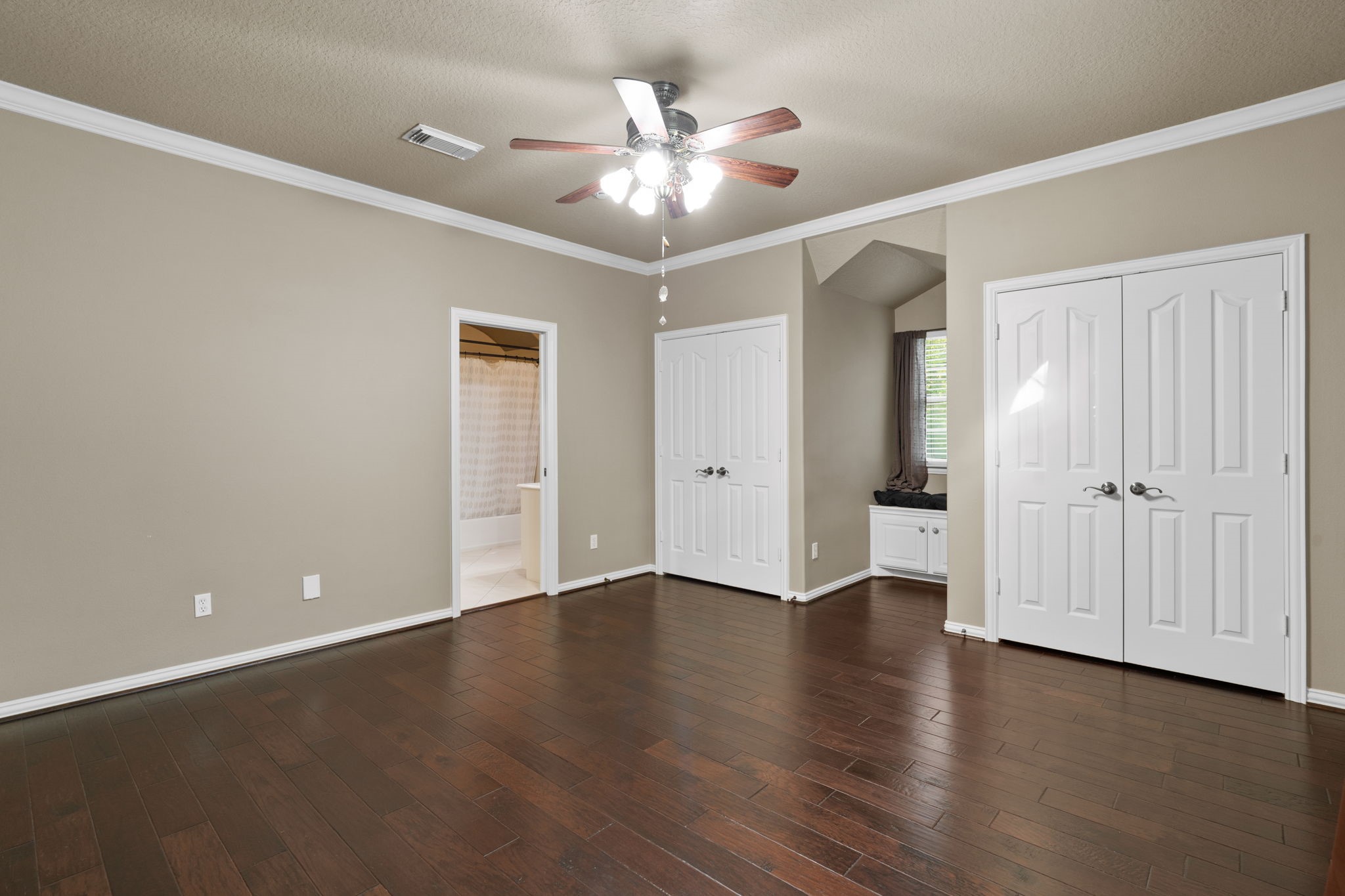 20002 Indigo Lake Drive Magnolia, TX 77355 - Photo 25 of 50 an empty room with wooden floor and ceiling fan