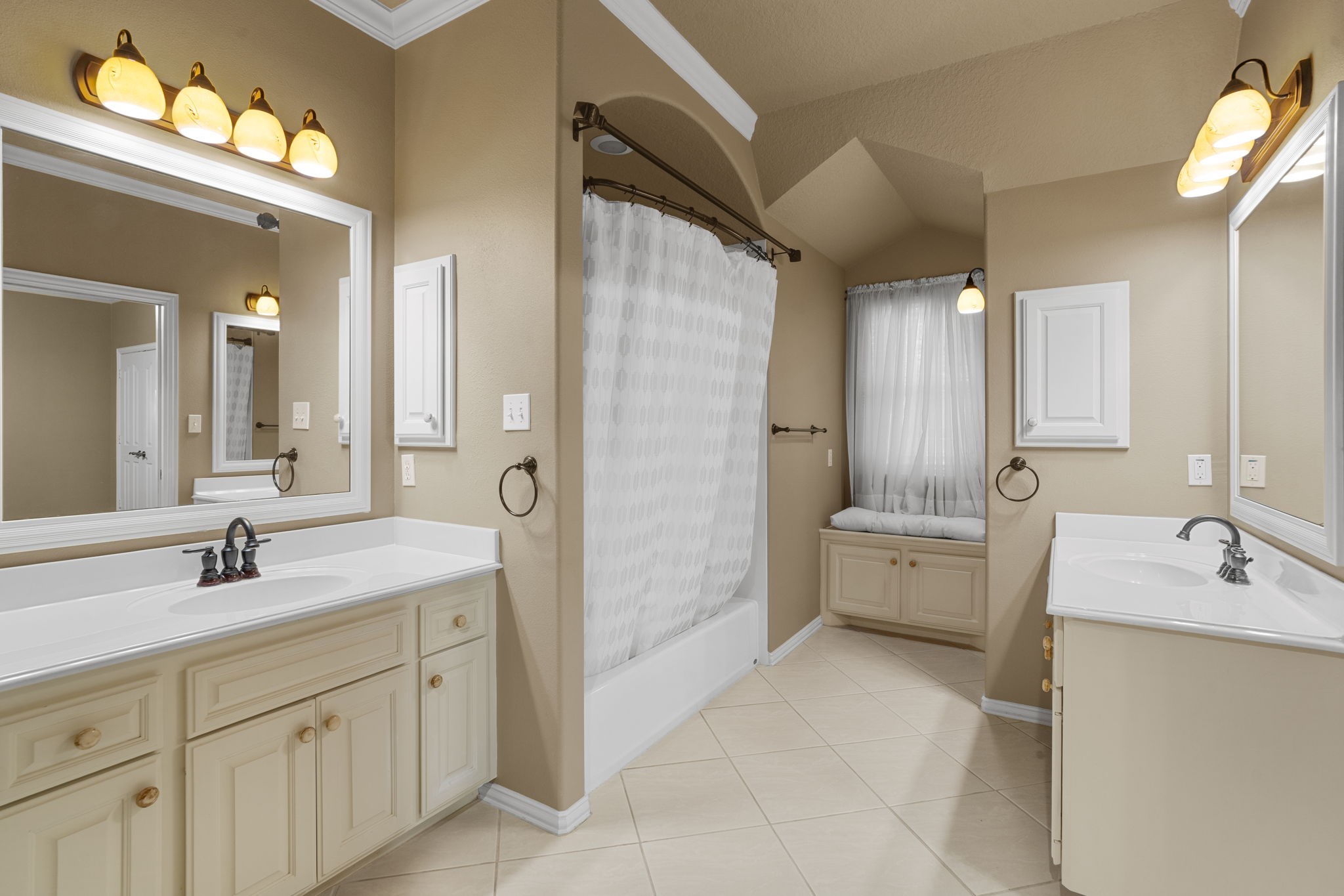 20002 Indigo Lake Drive Magnolia, TX 77355 - Photo 26 of 50 a bathroom with a double vanity sink mirror double and shower