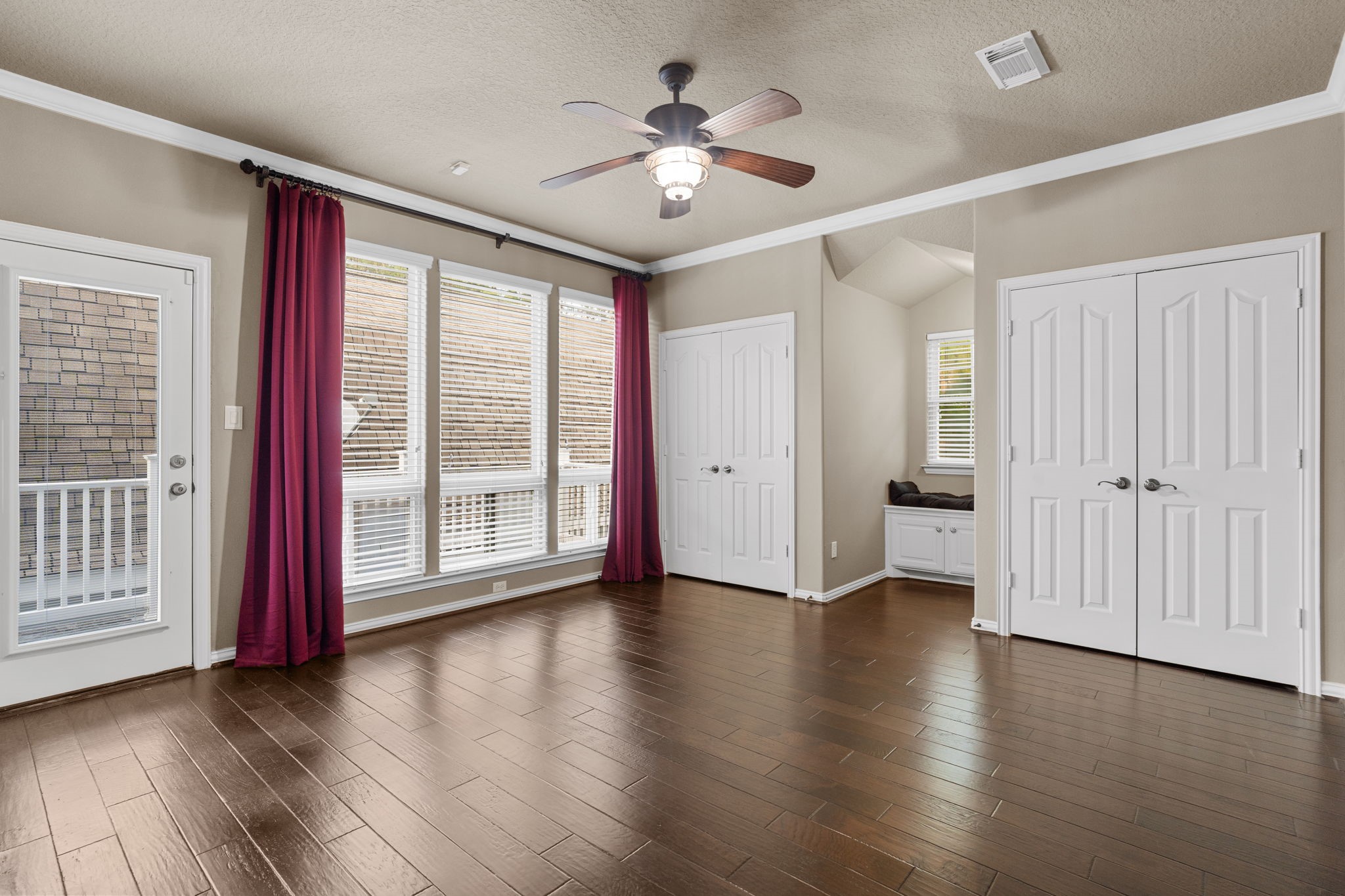 20002 Indigo Lake Drive Magnolia, TX 77355 - Photo 27 of 50 a view of an empty room with wooden floor and a window
