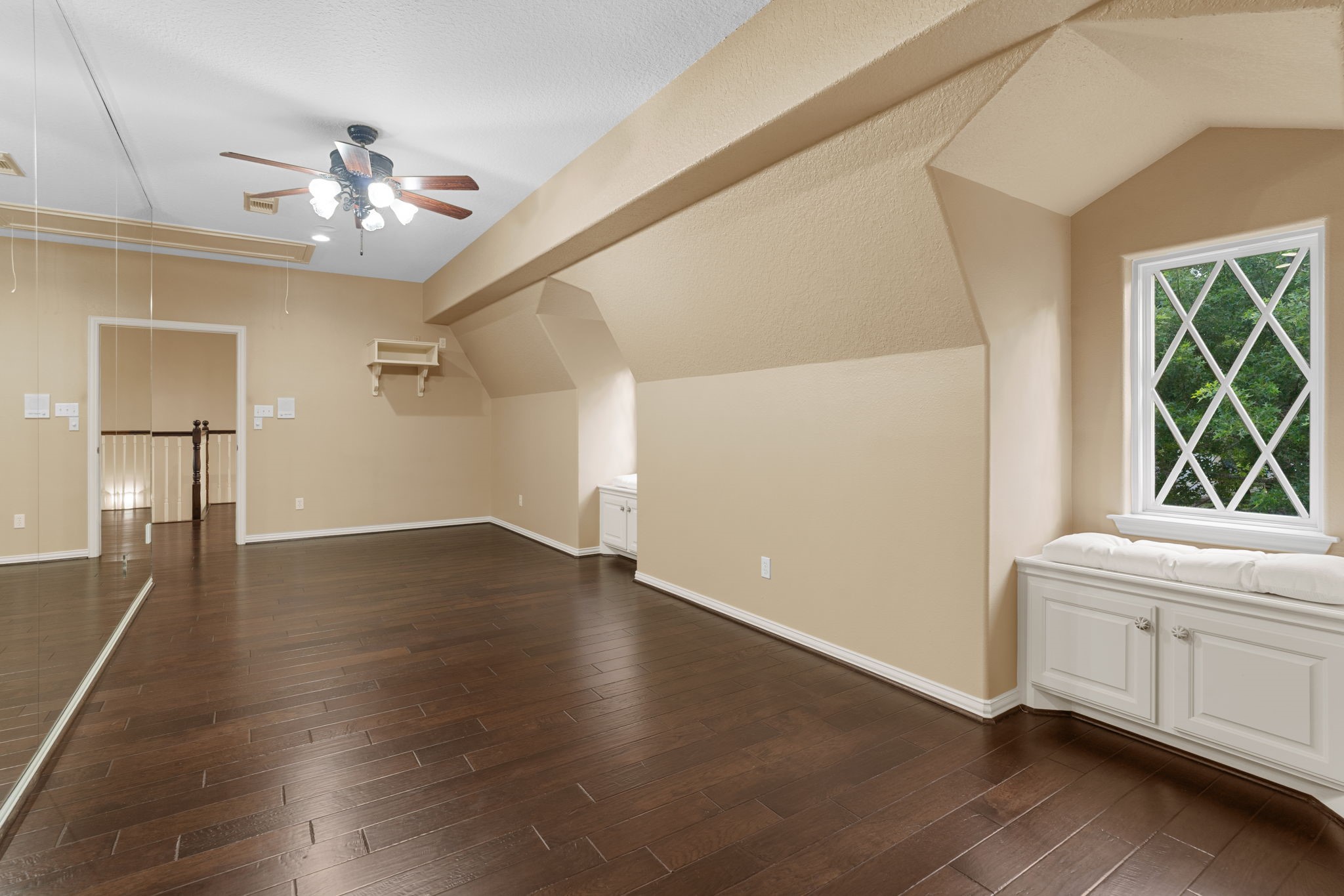 20002 Indigo Lake Drive Magnolia, TX 77355 - Photo 29 of 50 a view of an empty room with a window and wooden floor