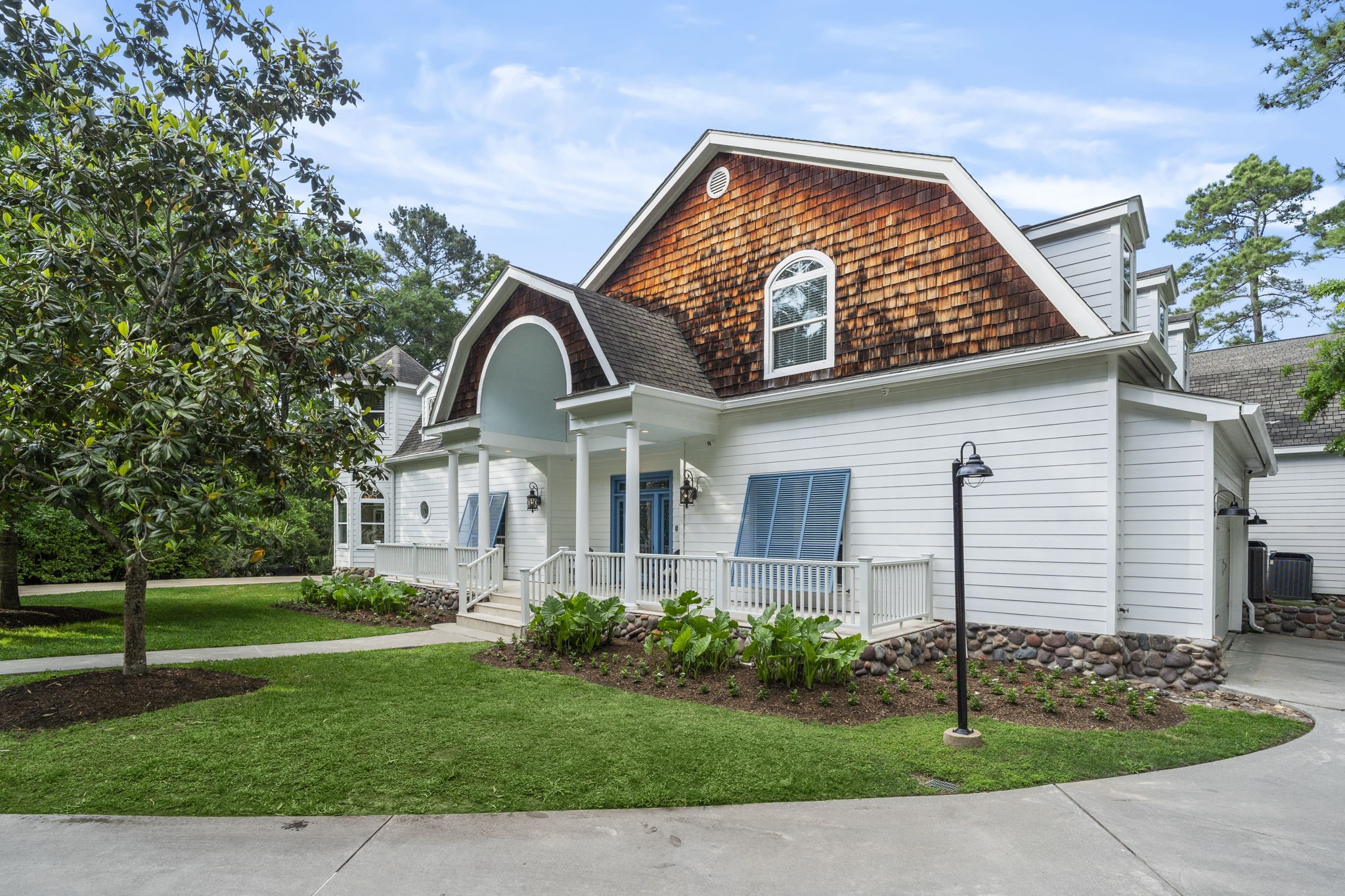 20002 Indigo Lake Drive Magnolia, TX 77355 - Photo 4 of 50 a front view of a house with garden
