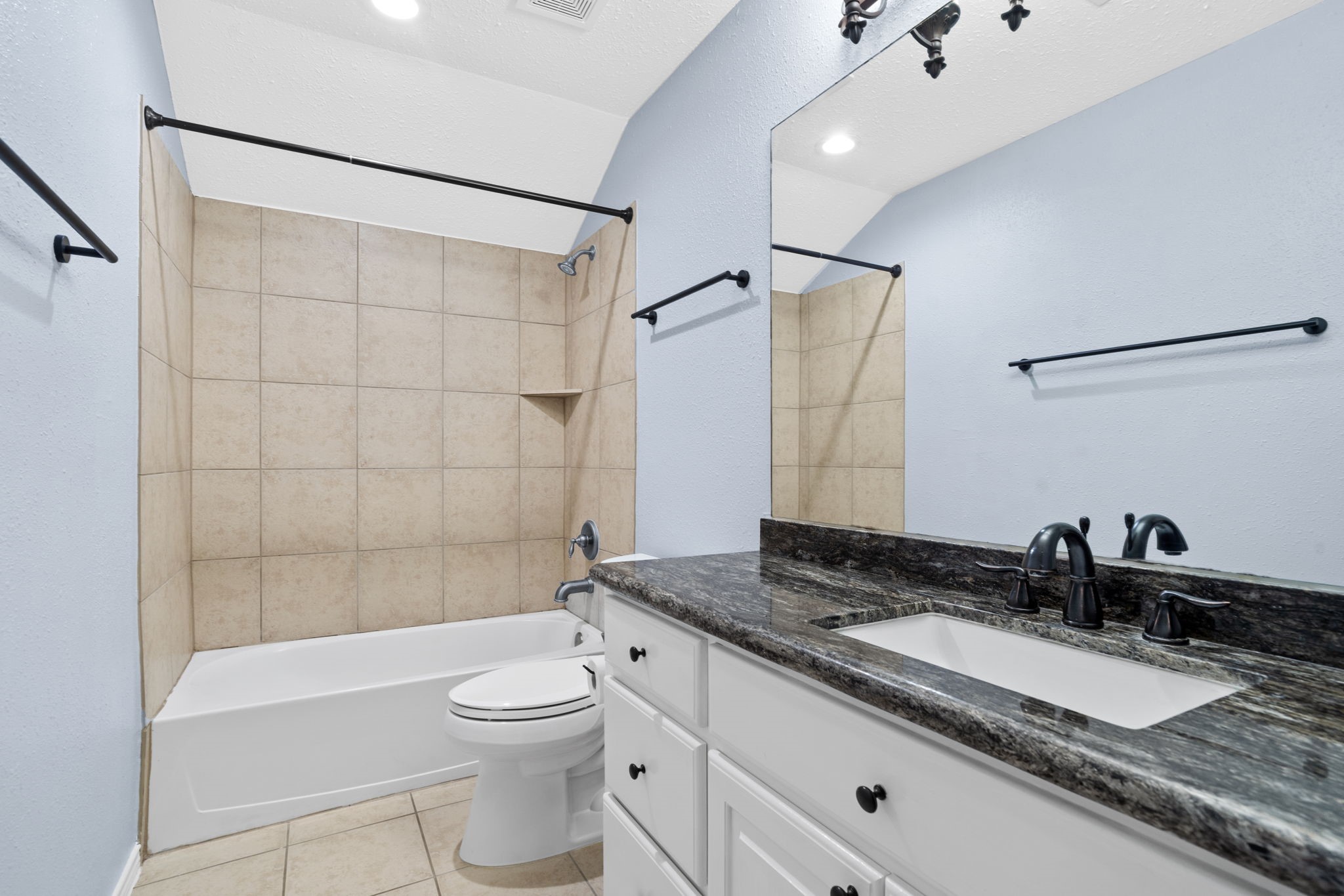 20002 Indigo Lake Drive Magnolia, TX 77355 - Photo 41 of 50 a bathroom with a granite countertop sink toilet a mirror and shower