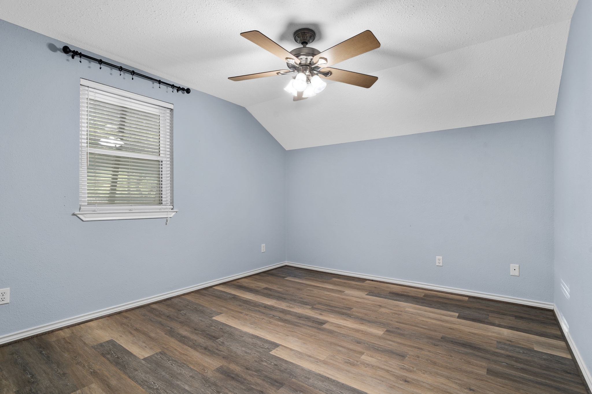 20002 Indigo Lake Drive Magnolia, TX 77355 - Photo 42 of 50 wooden floor in an empty room with a window