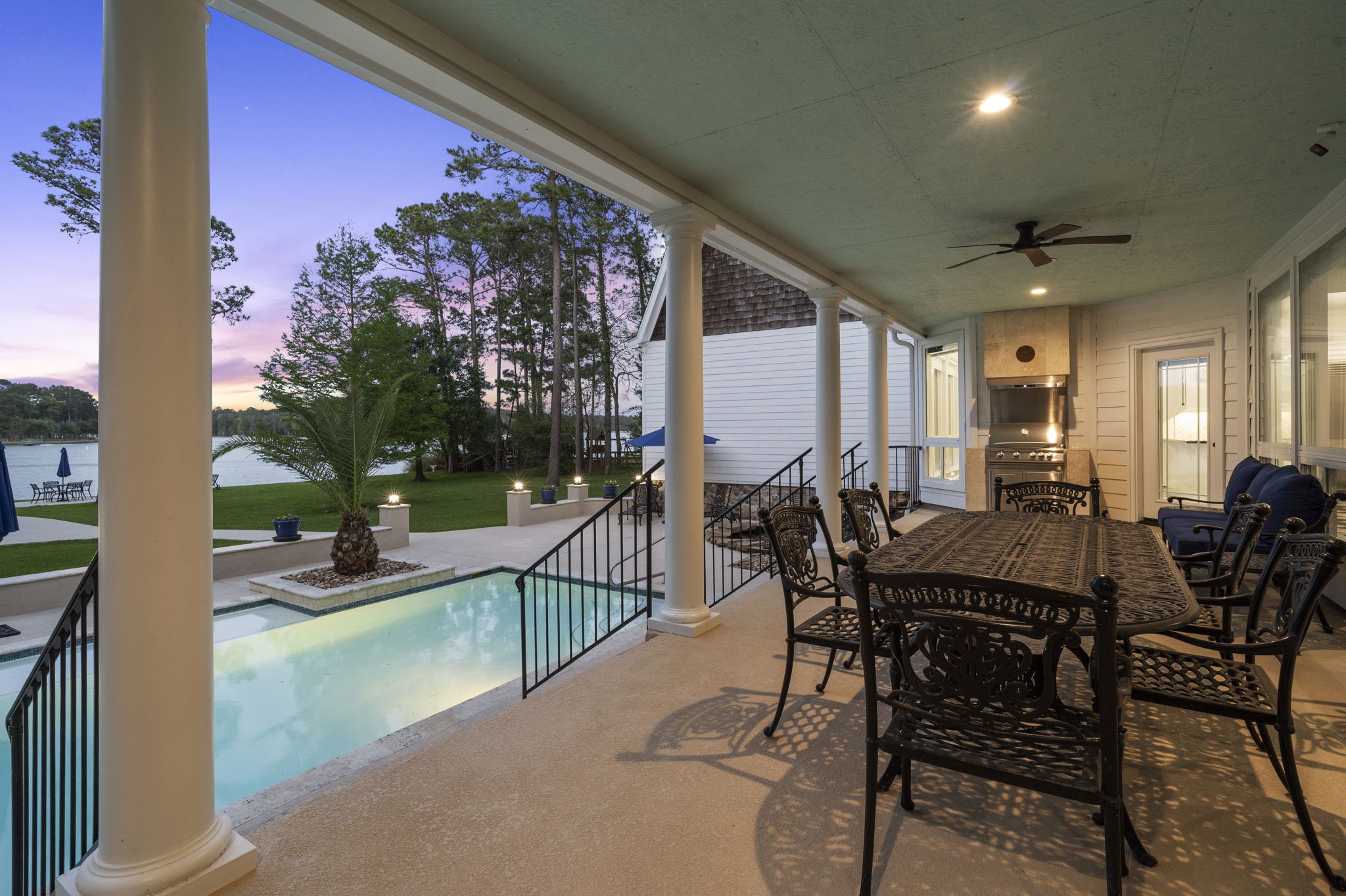 20002 Indigo Lake Drive Magnolia, TX 77355 - Photo 45 of 50 a view of a patio with a table and chairs