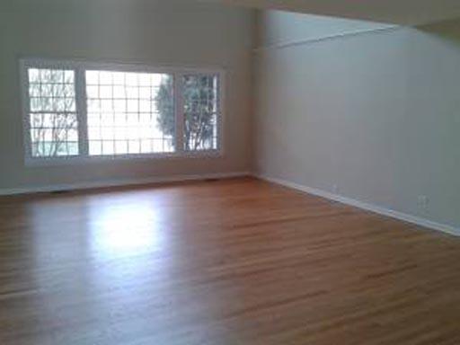 3929 Maple Avenue Northbrook, IL 60062 - Photo 3 of 16 an empty room with wooden floor and windows
