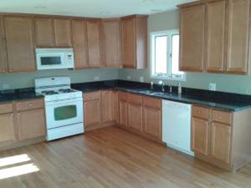 3929 Maple Avenue Northbrook, IL 60062 - Photo 5 of 16 a kitchen with stainless steel appliances granite countertop a stove a sink and a microwave