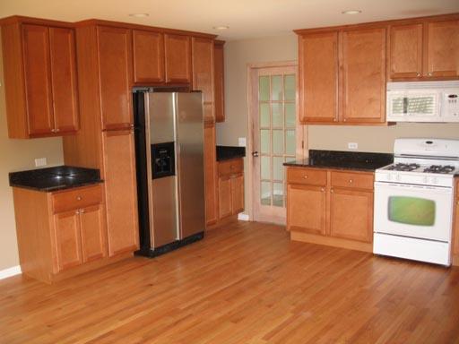 3929 Maple Avenue Northbrook, IL 60062 - Photo 6 of 16 a kitchen with a refrigerator stove and cabinets