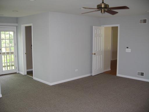 3929 Maple Avenue Northbrook, IL 60062 - Photo 9 of 16 an empty room with windows and fan