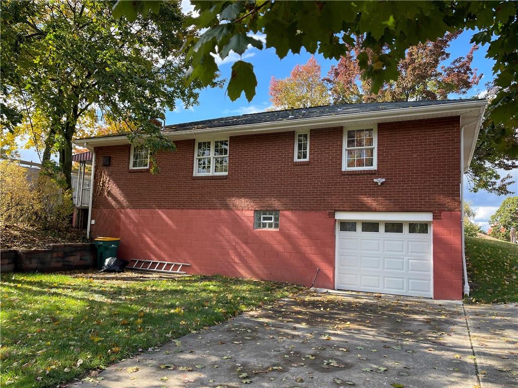 115 Bell Court Road McKees Rocks, PA 15136 - Photo 17 of 19 a front view of a house with a garden