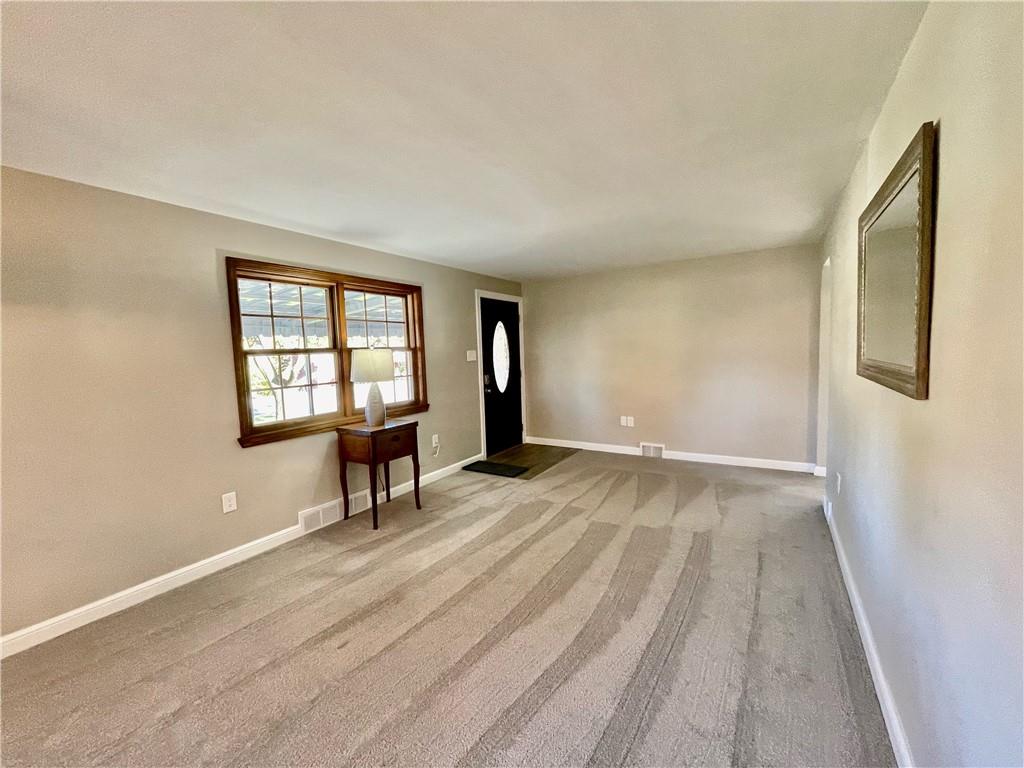 115 Bell Court Road McKees Rocks, PA 15136 - Photo 4 of 19 wooden floor in an empty room with a window