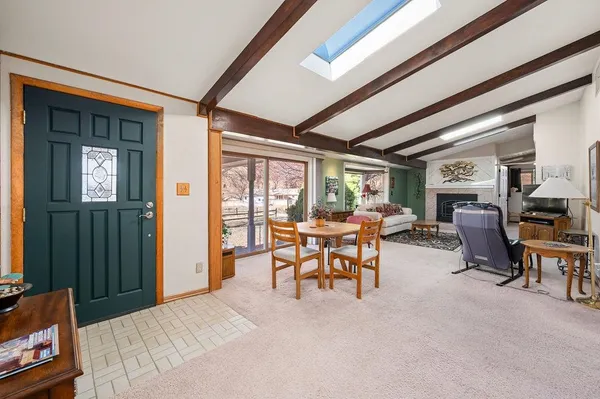 a view of a livingroom with furniture and window