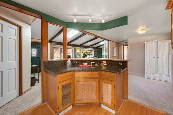 a kitchen with stainless steel appliances granite countertop a stove and a refrigerator