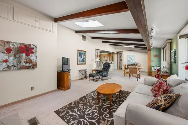 a living room with furniture and a rug