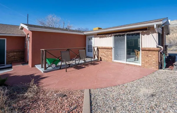 a front view of a house with yard and garage