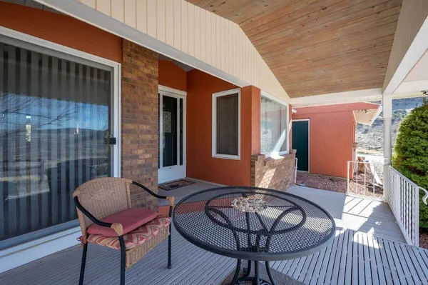 a view of a porch with furniture