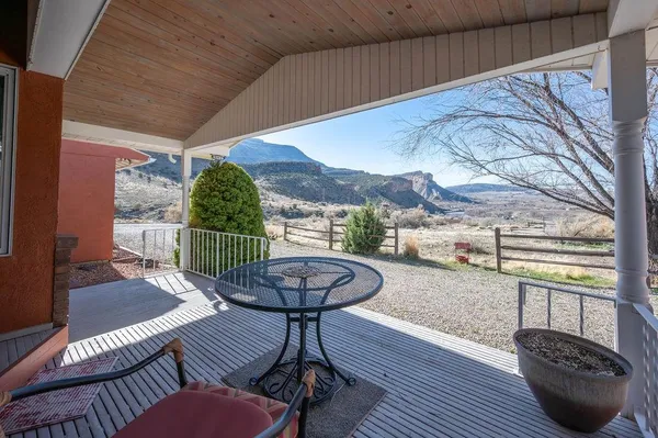 a view of a balcony with furniture