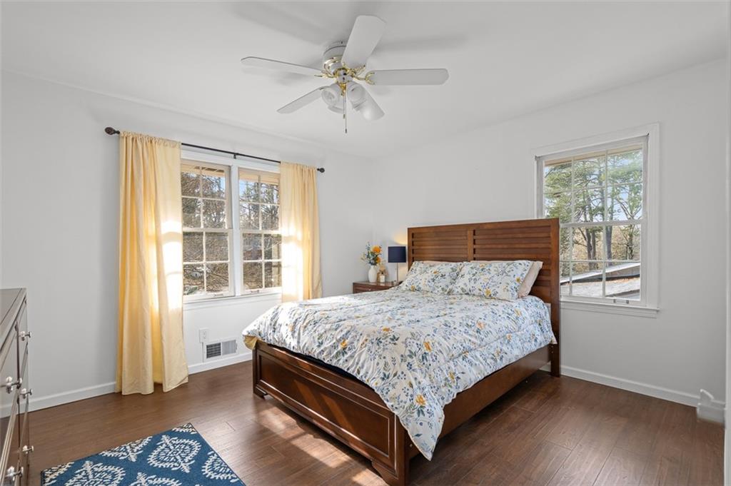 1436 Willivee Drive Decatur, GA 30033 - Photo 16 of 49 a bedroom with a bed lamp and a window