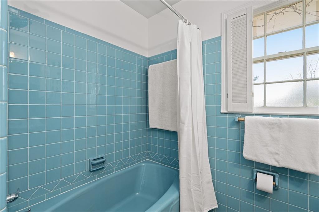 1436 Willivee Drive Decatur, GA 30033 - Photo 19 of 49 a bathroom with a bathtub and window