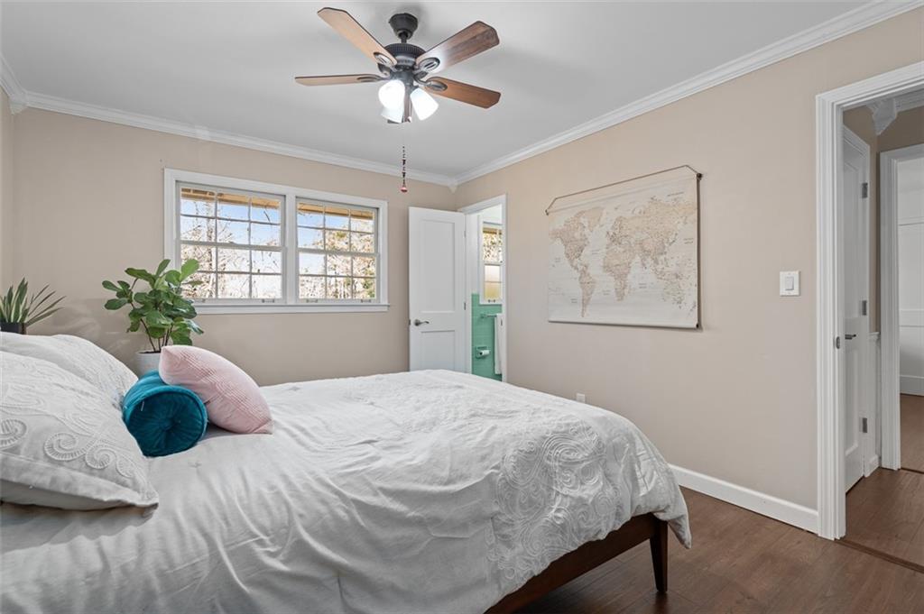 1436 Willivee Drive Decatur, GA 30033 - Photo 22 of 49 a bedroom with a large bed and a chandelier