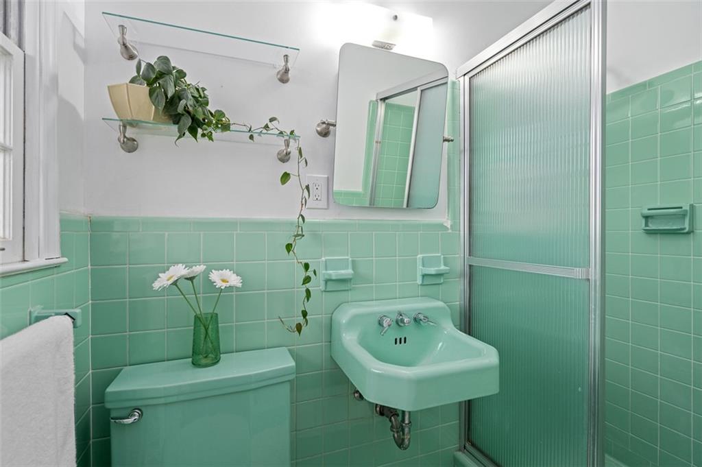 1436 Willivee Drive Decatur, GA 30033 - Photo 24 of 49 a bathroom with a sink a toilet and shower