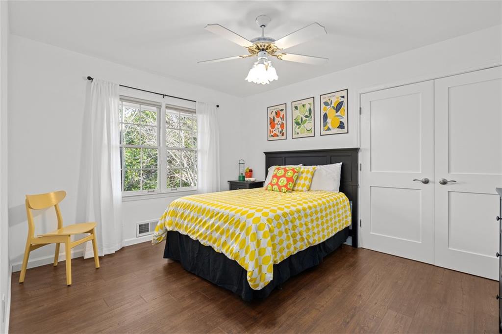 1436 Willivee Drive Decatur, GA 30033 - Photo 25 of 49 a bed sitting in a bedroom next to a window