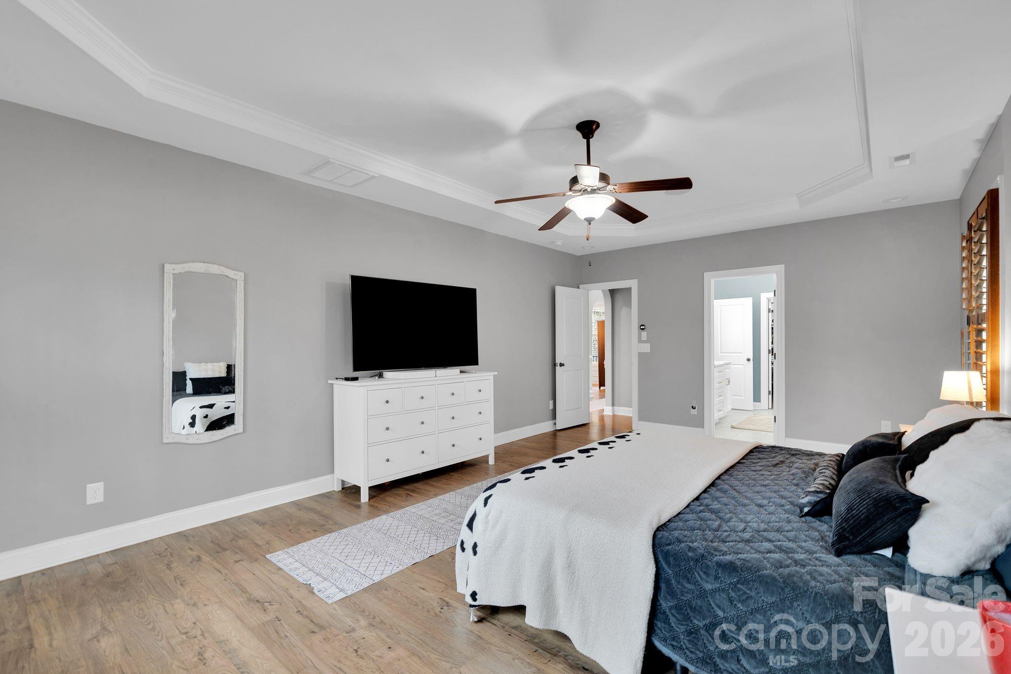 663 Highland Ridge Point Lake Wylie, SC 29710 - Photo 13 of 42 a bedroom with a bed a window and a television