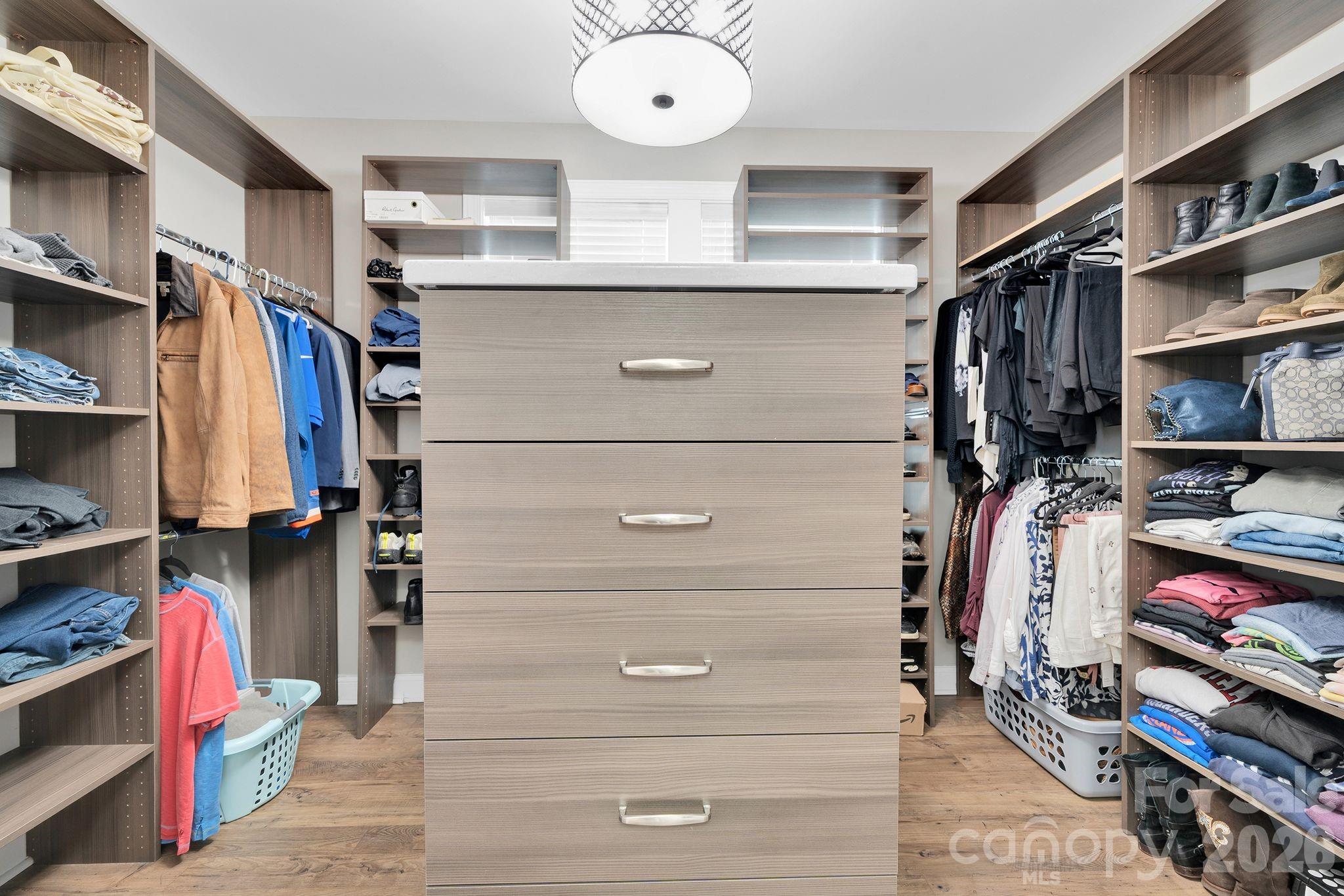 663 Highland Ridge Point Lake Wylie, SC 29710 - Photo 16 of 42 a view of walk in closet with clothes and shoes