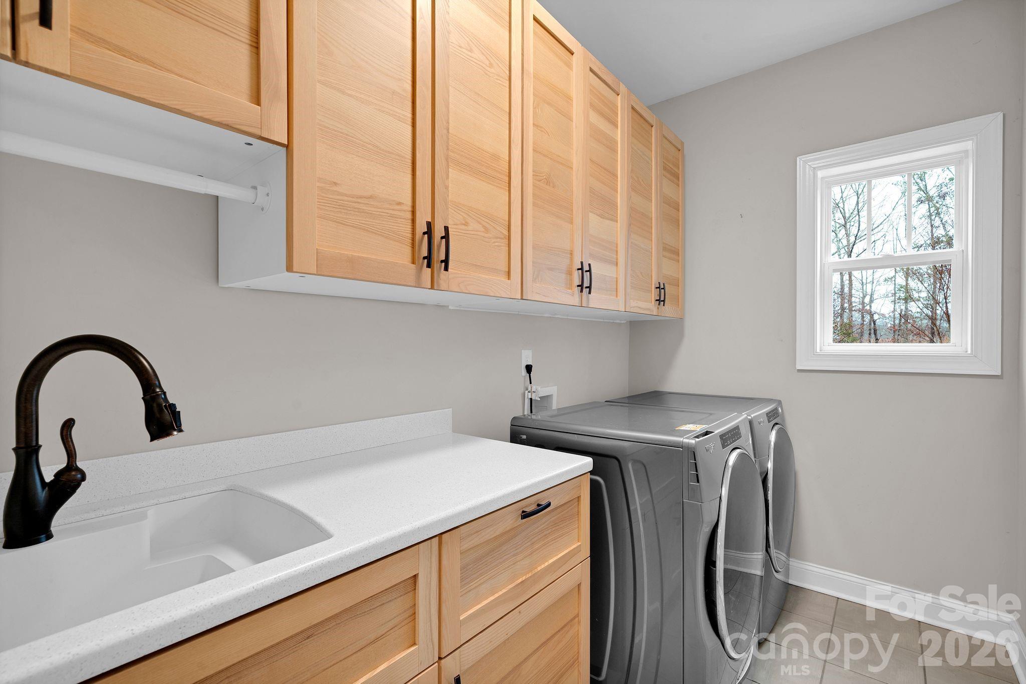663 Highland Ridge Point Lake Wylie, SC 29710 - Photo 17 of 42 a view of a kitchen with sink and washing machine